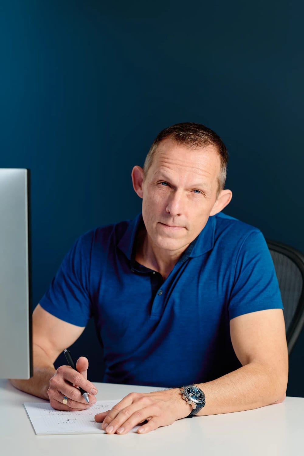 Axel Rittershaus seated at his desk, personal branding photography, Franschhoek