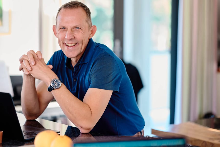 Axel Rittershaus at the table in his Franschhoek home, personal branding session