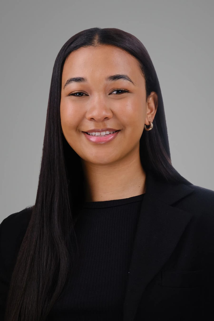 A colleague on the same grey background, same lighting and crop