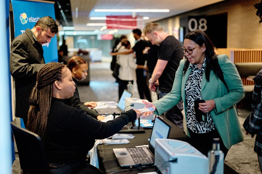 Delegates checking in at the branded registration desk, Elastic conference 2025, Century City Conference Centre, Cape Town