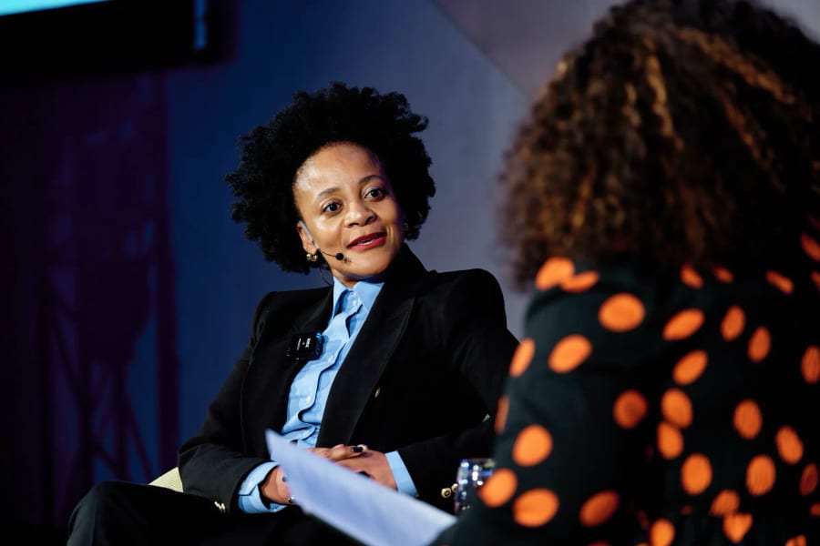 Conference panel discussion on stage, Cape Town