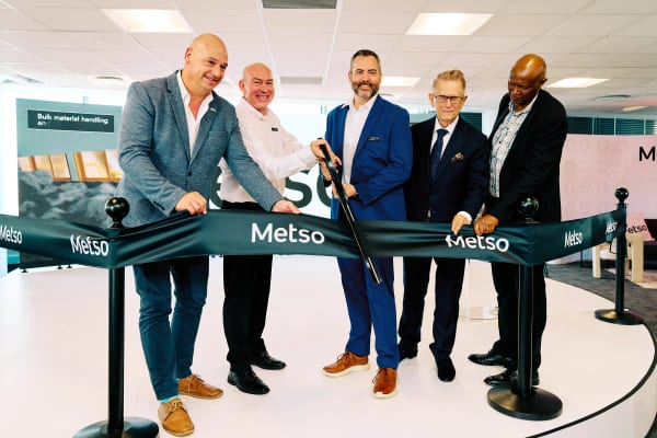 Five executives cutting the ribbon to open a new corporate office, Cape Town