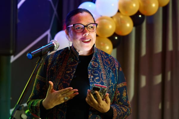 Speaker addressing guests at a corporate anniversary celebration, Cape Town