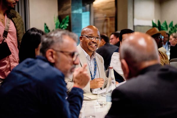 Candid networking moment at a corporate dinner, Cape Town