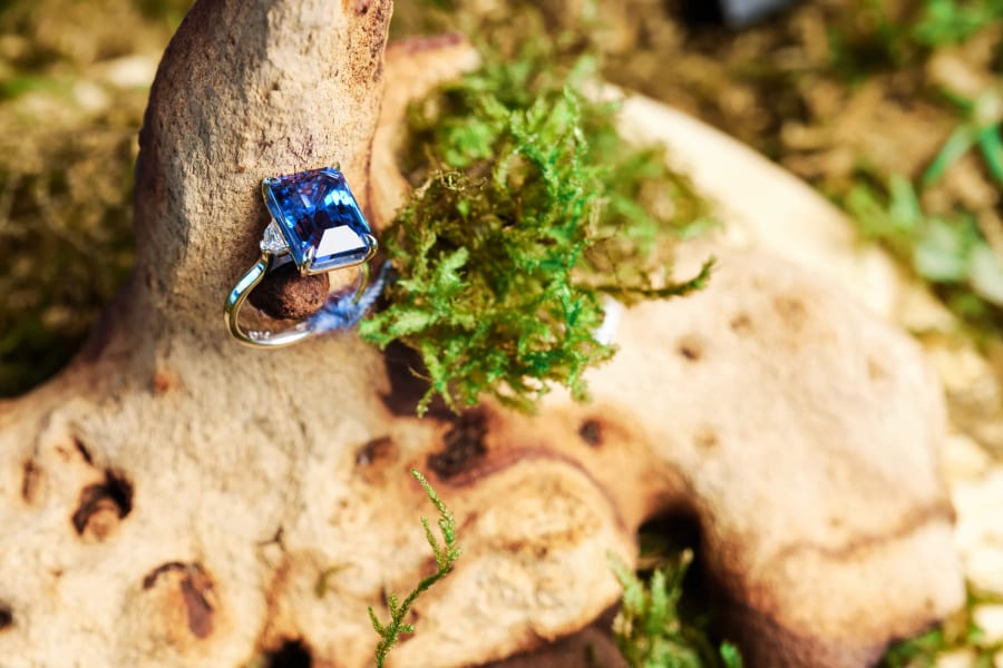 Close-up of a blue gemstone ring displayed on stone and moss, Mineshift, Zeitz MOCAA, Cape Town