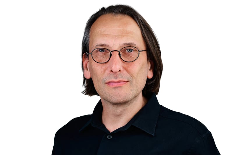 Studio headshot of Jürgen Banda-Hansmann, owner and corporate photographer at Jürgen's Photography in Cape Town