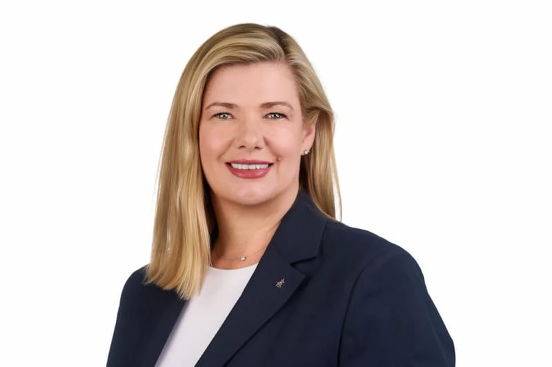 Professional headshot of a Cape Town estate agent and property practitioner, corporate portrait with white background