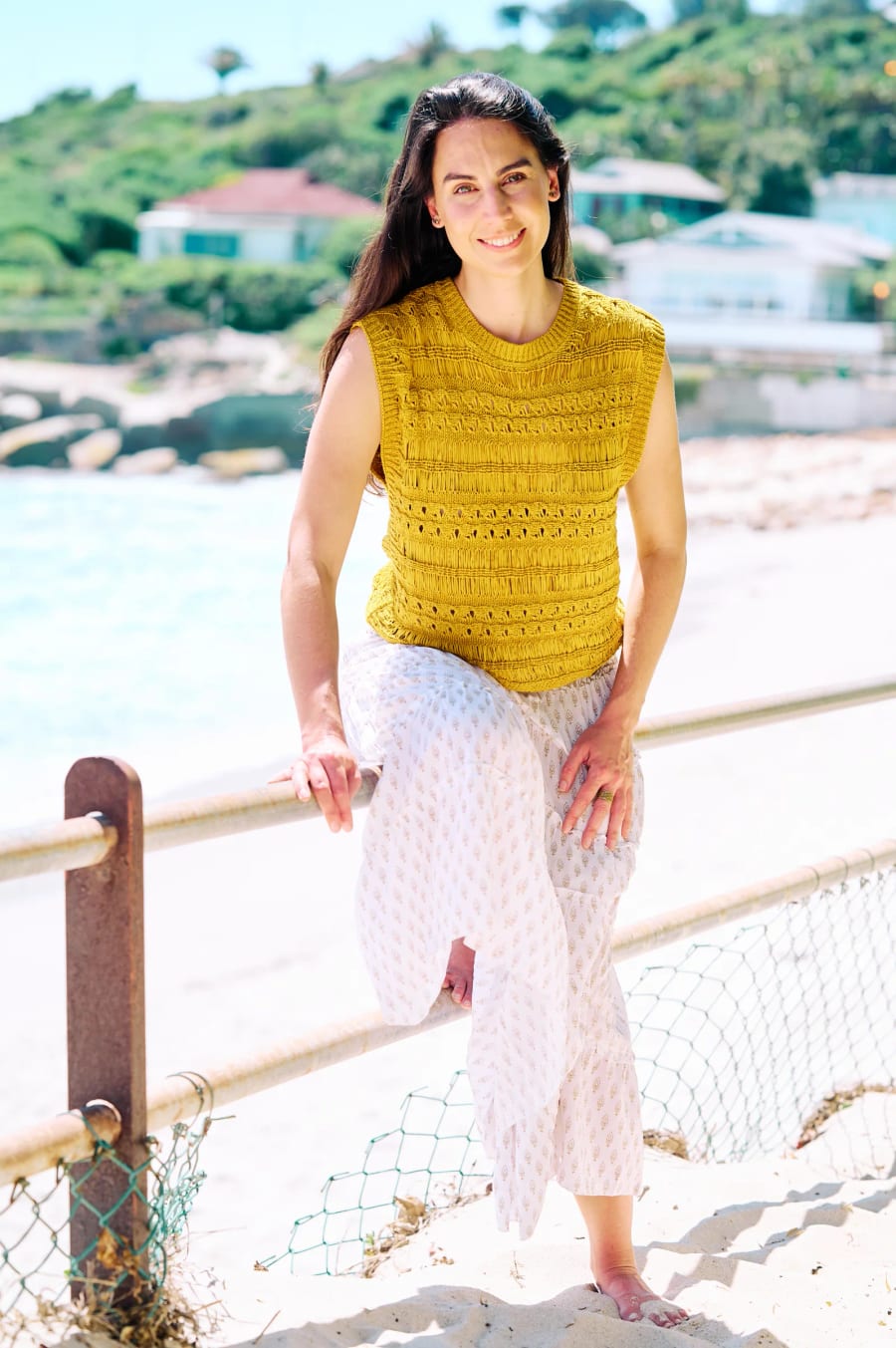 Personal branding portrait, seated on a seaside railing, Cape Town