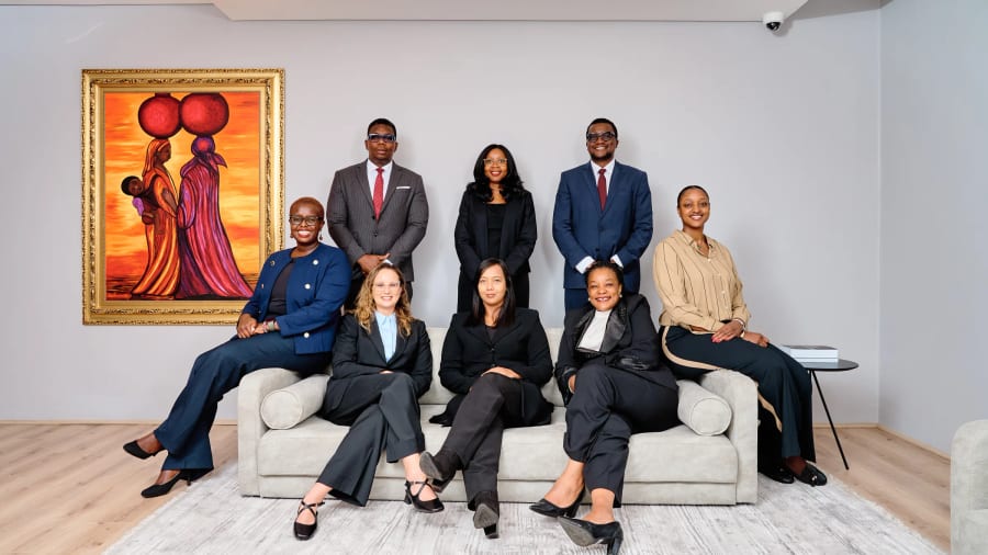 A whole team photographed together in their office