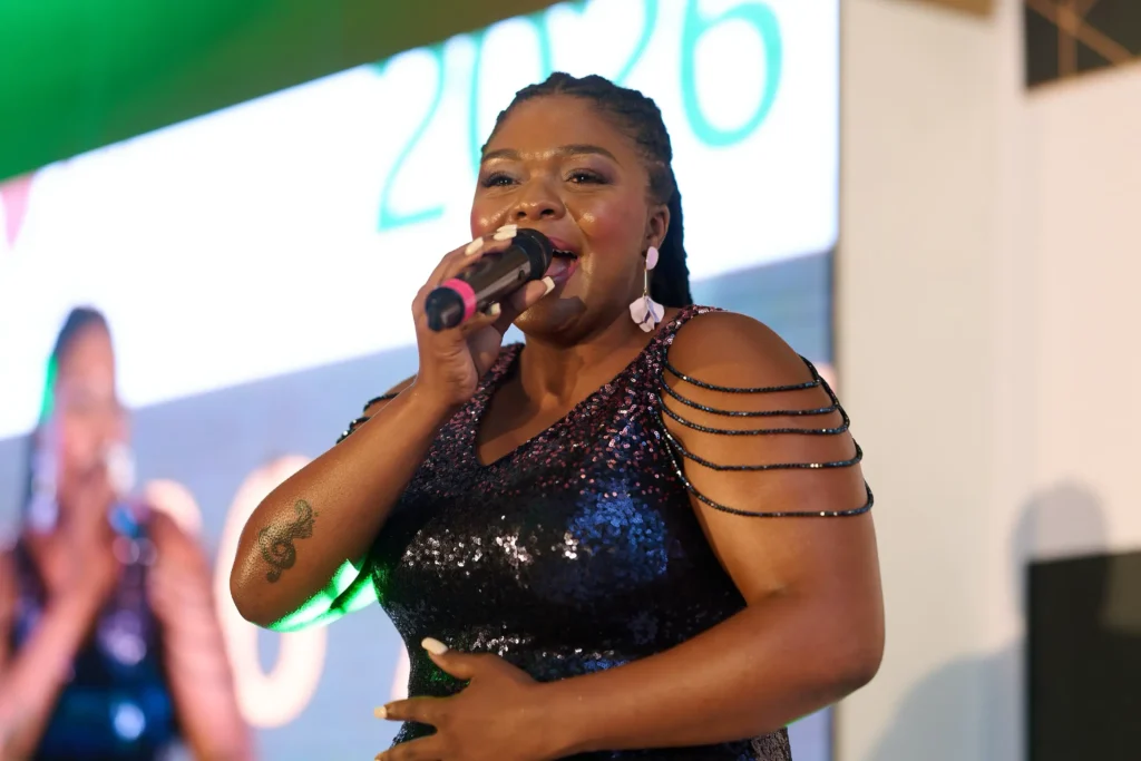 Live entertainment performer singing on stage at a corporate gala dinner in Cape Town.