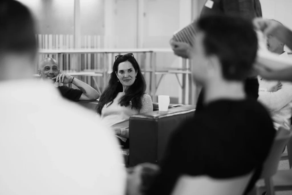 Participants in an interactive session at the Solve Differently workshop, photographed in black and white, Cape Town