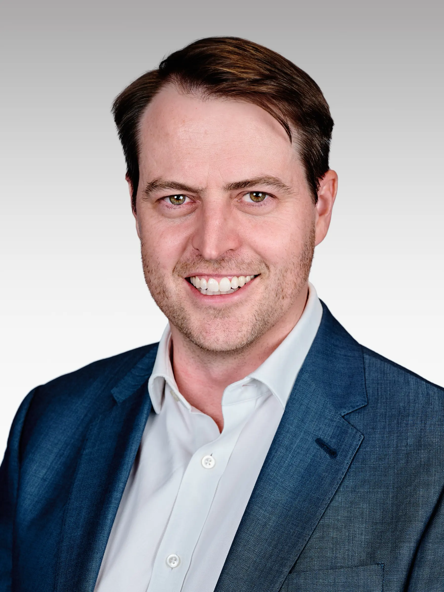 Corporate executive headshot in a blue blazer, professional portrait photographed in Cape Town