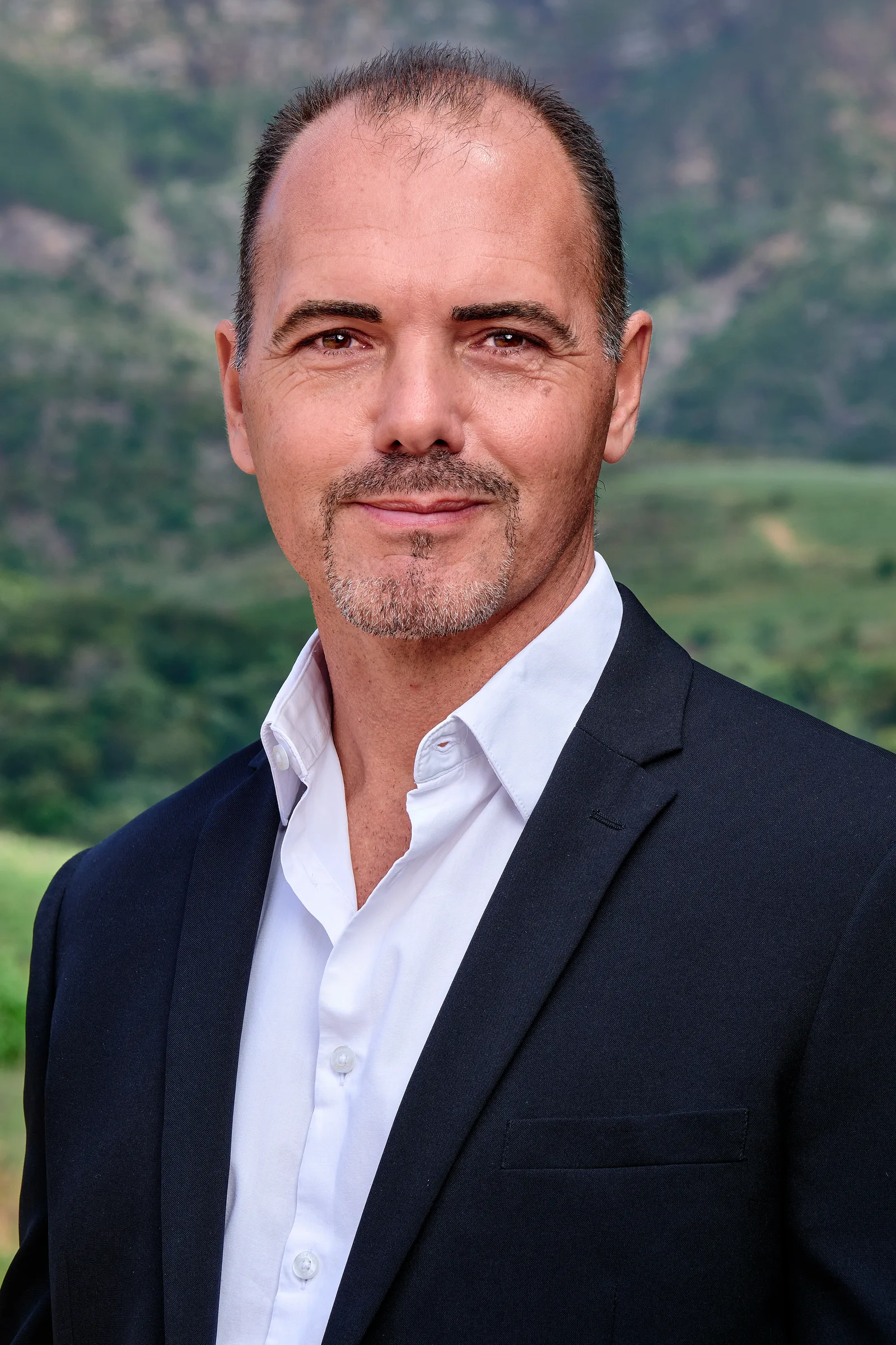 Estate agent professional portrait photographed outdoors in Cape Town with mountain backdrop