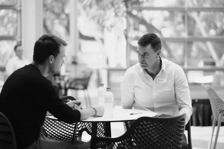 Corporate photography capturing an intimate one-on-one discussion during a Cape Town workshop