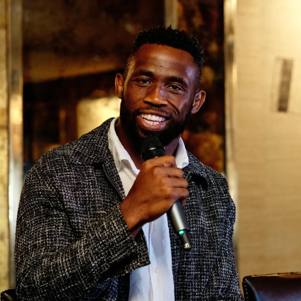 Springbok Captain Siya Kolisi interviewed during a corporate event.