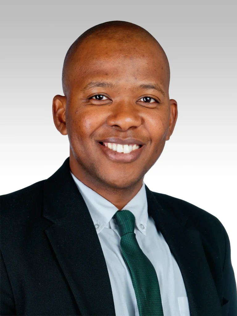 Male business headshot, gradient backdrop
