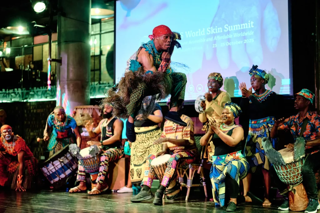 Traditional African dancers performing on the Gold Restaurant stage at a Cape Town corporate gala, captured by a professional event photographer.