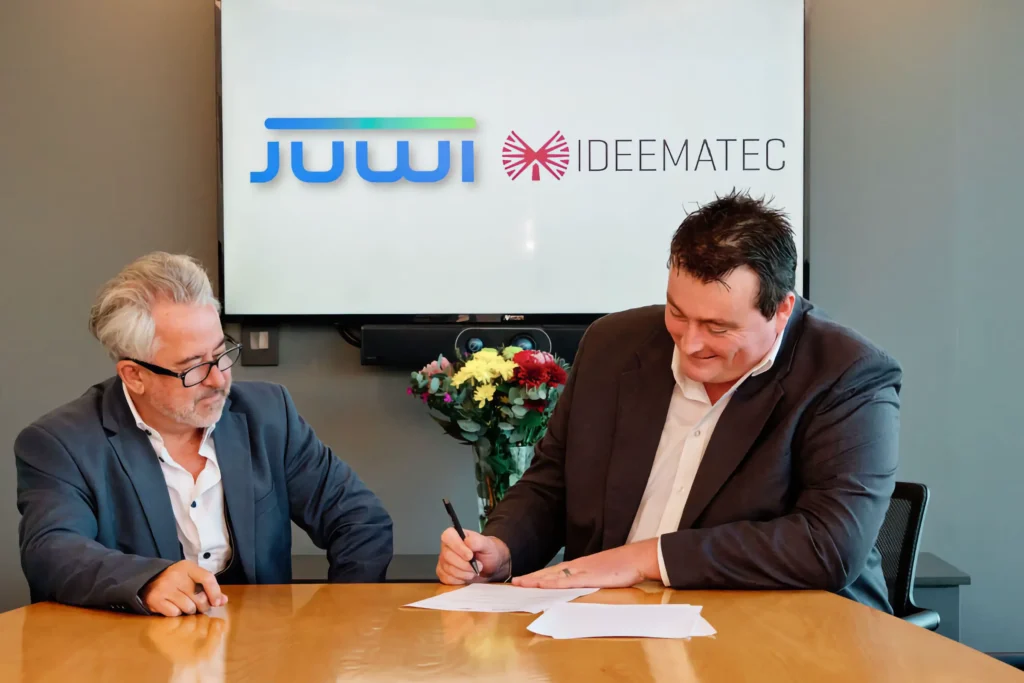 A key business milestone captured through professional corporate event photography, documenting a formal contract signing and successful partnership.