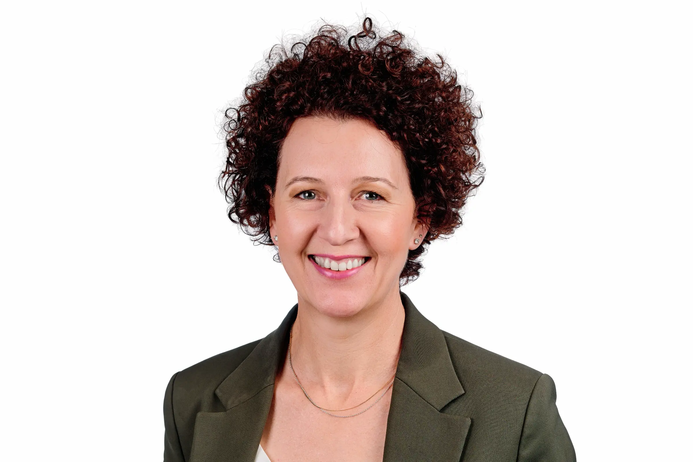 Vibrant branding portrait of a female professional in a green jacket, designed for LinkedIn profiles and marketing materials.